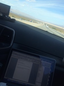 Nicola writing book while driving